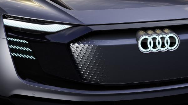 The four-ring logo is decorated both front and rear. four-ring logo of Audi E-Tron Sportback