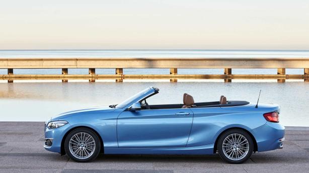 This car is decorated with four sets of alloy wheels. Side view of BMW M2