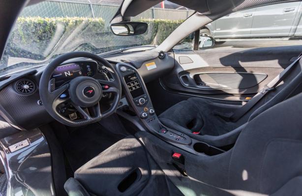 The interior of the car is beautiful in black, with inserts in carbon fiber, matte and leather seats with black Alcantara. Supernova Silver McLaren P1's interior