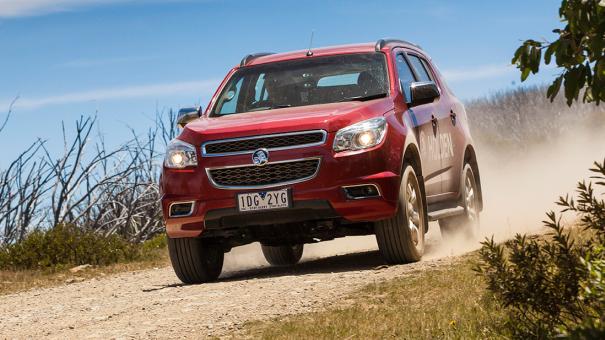 Larger vehicles are more helpful in mountainous, wooded, or rough terrain areas. Off-road red SUV