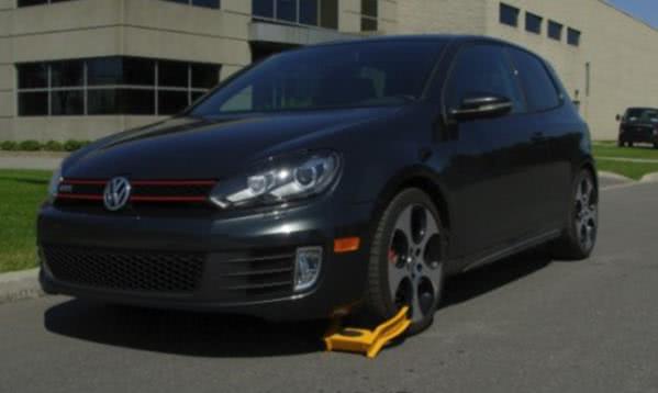 You can get a specialty boot lock which only you are able to take off A car locked with a wheel boot lock