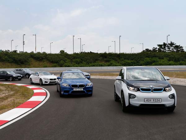 Merkel told Germany was unlikely to achieve the government's ambitious target of putting one million electric vehicles (EV) on the roads. BMW cars on the road