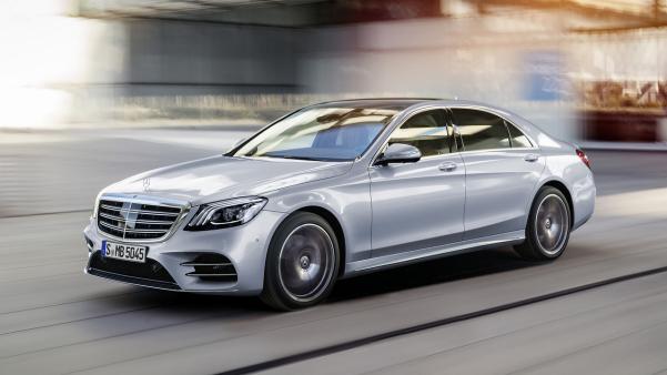 2018 Mercedes-Benz S350d is sharing an inline-six 3.0-liter engine and developing 286 hp angular front view of a silver 2018 Mercedes-Benz