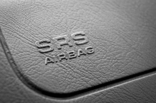 The deal will cover nearly 16 million recalled vehicles in the United States SRS airbag lettering on leather surface