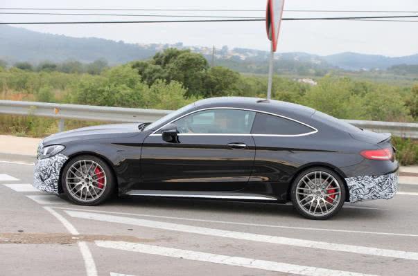 This C63 sedan test mule features halogen headlights which are usually seen for entry-level models in the premium category Mercedes AMG C63 Coupe Facelift side view