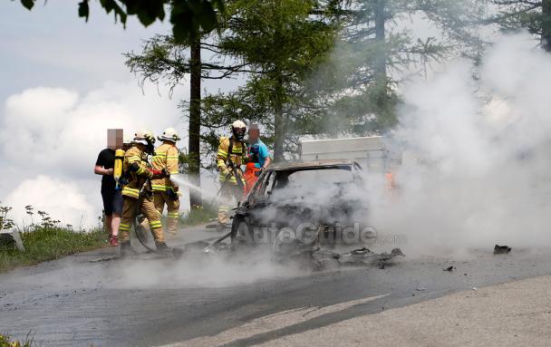 A hand-held fire extinguisher wasn’t enough to stop the flames spreading. Firefighters are putting out the fire in the Audi A7