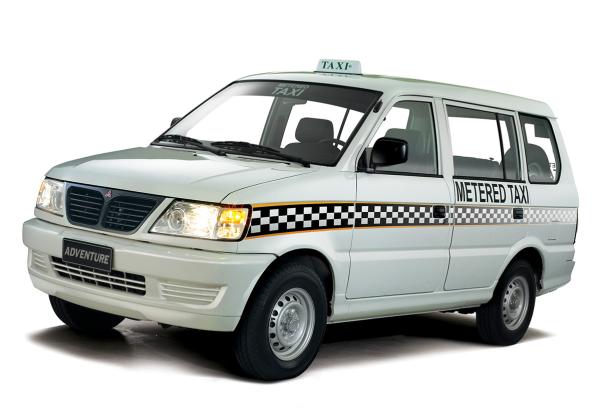 The Mitsubishi Adventure TX can carry more than 7 passengers angular front of the Mitsubishi Adventure TX taxi