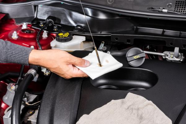 Every car needs motor oils and fluids to keep the car engine running smoothly The drive is checking motor oils and fluids
