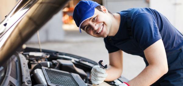 One of the vehicle's parts which is easily influenced by the heat is the engine A car mechanic is checking the engine bay