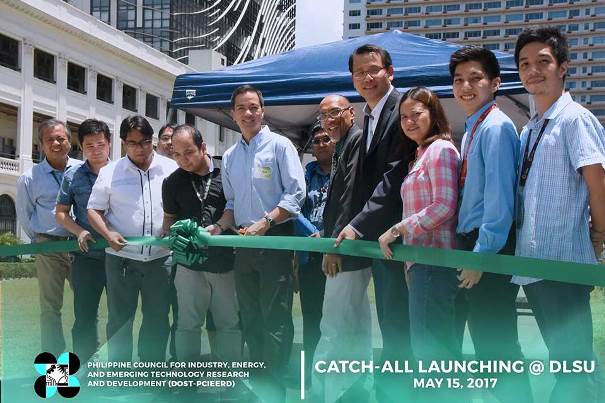 The De La Salle University (DLSU) launched its very useful software called as the Contactless Apprehension of Traffic Violators on a 24-Hour Basis and All-Vehicle Detection System (CATCH-ALL) People cutting a green ribbon at the launching ceremony of CATCH-ALL