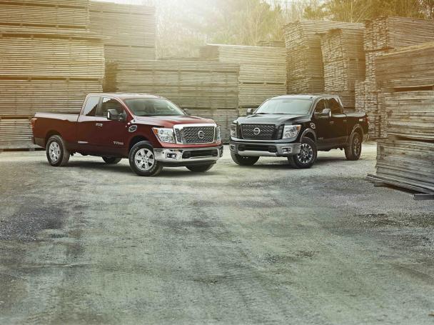 The 2017 Nissan Titan King Cab is now available for sale in the US dealerships two 2017 Nissan Titan King Cab parking opposite
