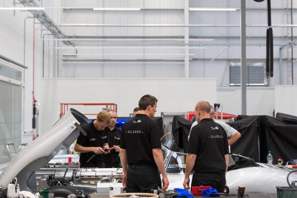 JLR has invested heavily in traditional manufacturing skills with more than 80 specialists Specialists working on a Jaguar engine at Classic Works