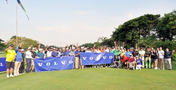 Volvo graciously invites you to join the third installment of the yearly Volvo National Alumni Golf Cup by putting together a team that will represent your university or college People posing for a group photo in the middle of a green golf course