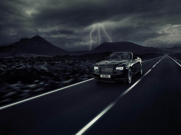 Following the Ghost and Wraith, the high-performance Black Badge model currently joins the Dawn lineup The Rolls-Royce Dawn Black Badge on the road
