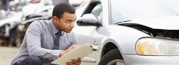Pay close attention to any visible signs of rust A man is checking his car's bodywork
