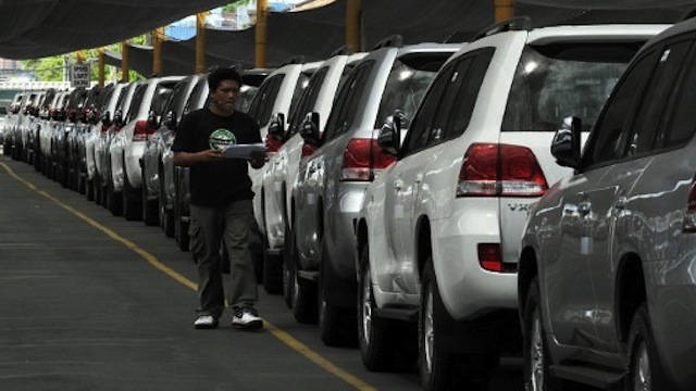 House Bill 3928 seeking to increase the excise tax automobiles for every additional vehicle purchased A man waling along a line of new cars