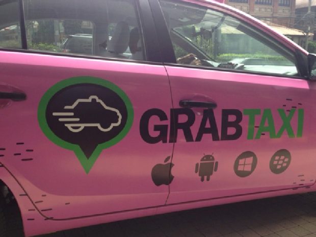 Only vehicles with Certificate of Public Convenience (CPC) and Provisional Authority (PA) will be allowed to continue operating A pink car side with grab taxi sticker