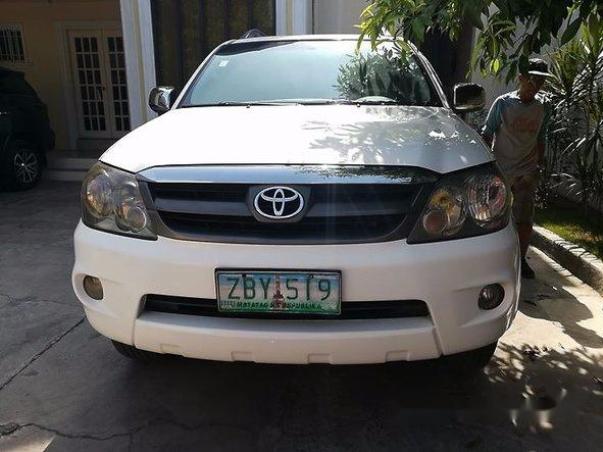 My brother and his 2005 Toyota Fortuner Front of the 2005 Toyota Fortuner