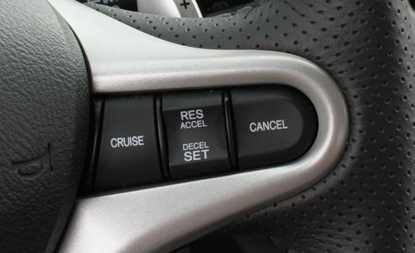 Cruise Control is an automatic system controlling the speed of a car cruise control button in a car