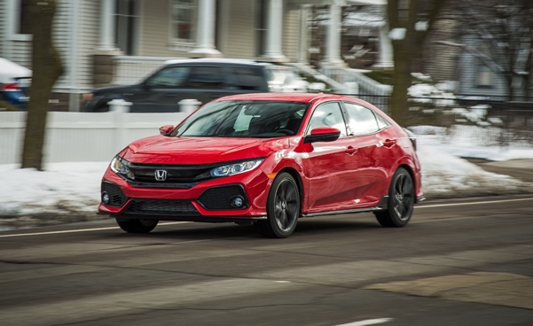 A red Honda Civic on the road