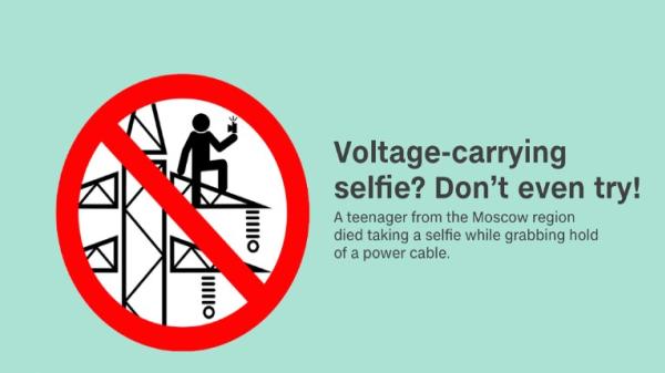 Don't even try a voltage-carrying selfie A sign warning not taking selfie on voltage