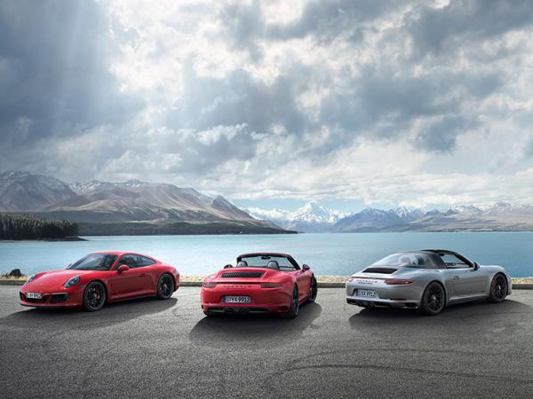 The company can’t say whether the hybrid will be a commercial success or not three Porsche 911 models
