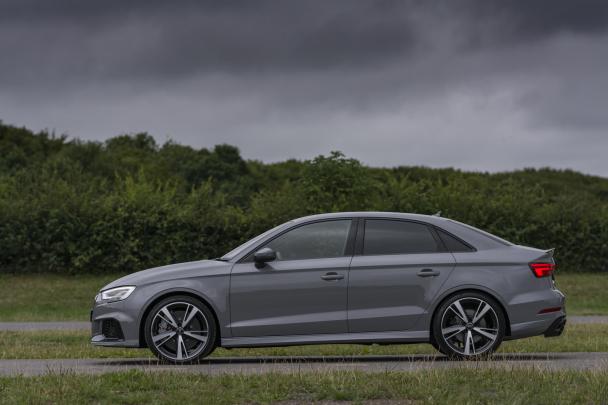 Audi has announced the pricing and updated specifications of the Audi RS3 side view of the 2018 Audi RS3 sedan