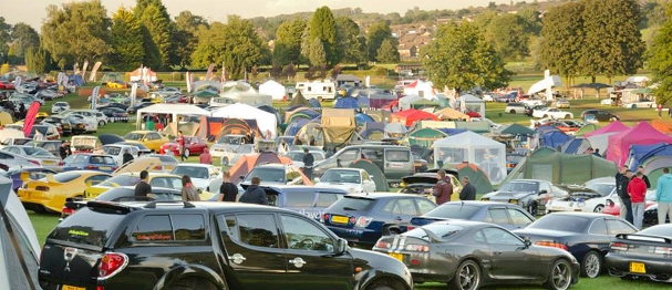 Car clubs: the hidden benefit of car ownership An image of an outdoor car meeting
