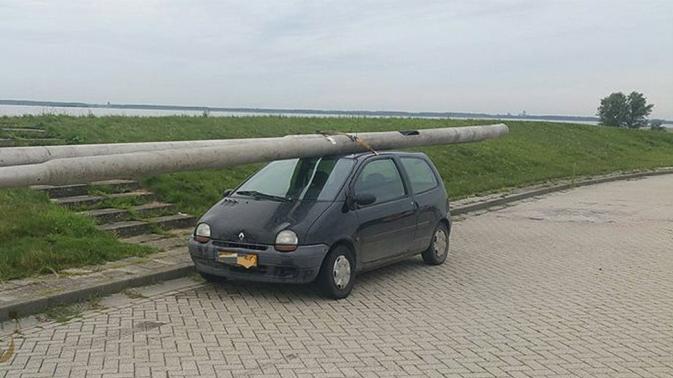 A man arrested for driving with two stolen lamp posts on the roof of his Renault