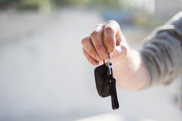 a car owner holding his car key