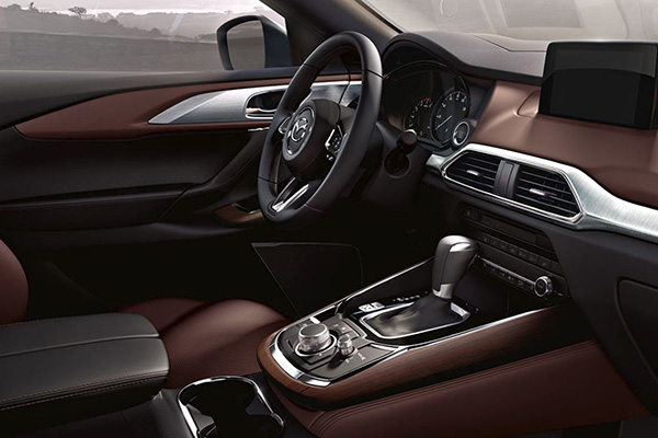 An alternate picture of the Mazda CX-9 2019 interior highlighting the dash, the steering wheel, and the infotainment system