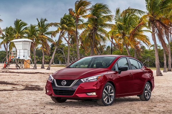 A picture of the 2020 Nissan Almera on a beach