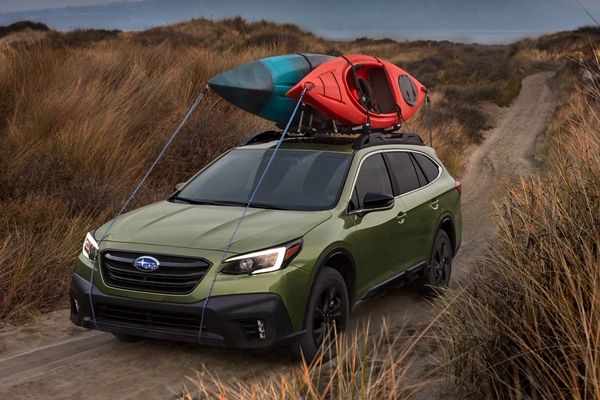 A picture of the 2020 Subaru Outback carrying canoes.