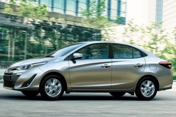 A Toyota Vios travelling in the city