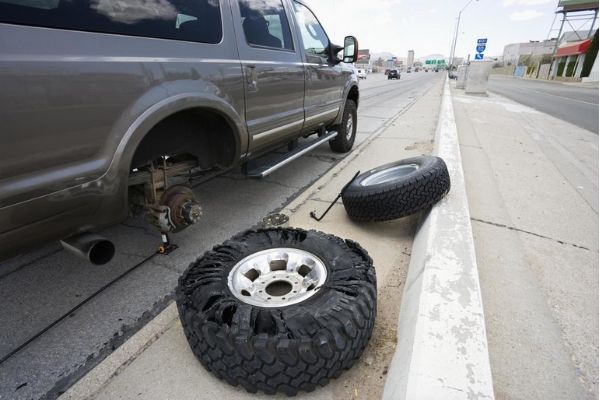 A pick-up truck with a flat tire