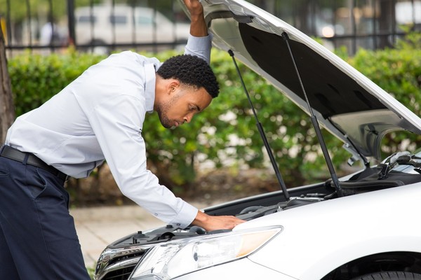 Man checking the car engine