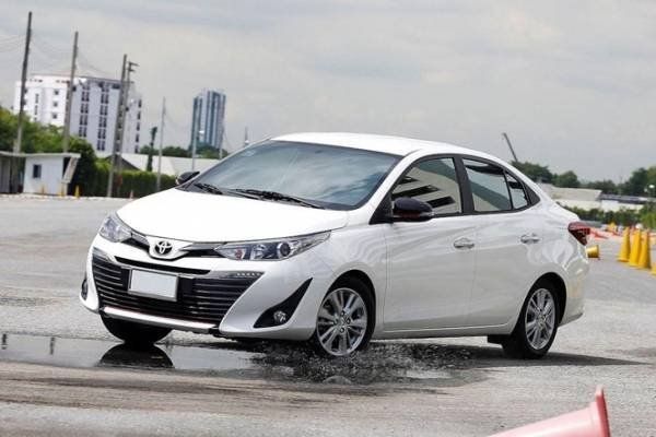 The Toyota Vios, like the Corolla of old is an affordable yet reliable sedan for the masses A picture of a white Toyota Vios doing some aggressive driving
