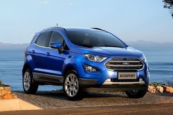 A picture of a blue Ecosport near a cliff