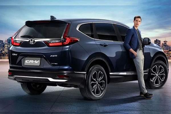 A picture of a man with the 2021 Honda CR-V.