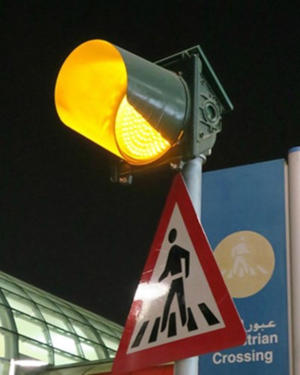 yellow road sign with traffic light meaning