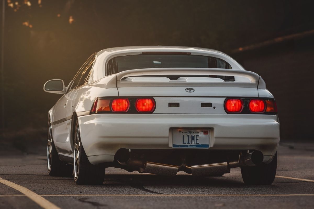 What does a muffler do? How does it differ from a car exhaust?