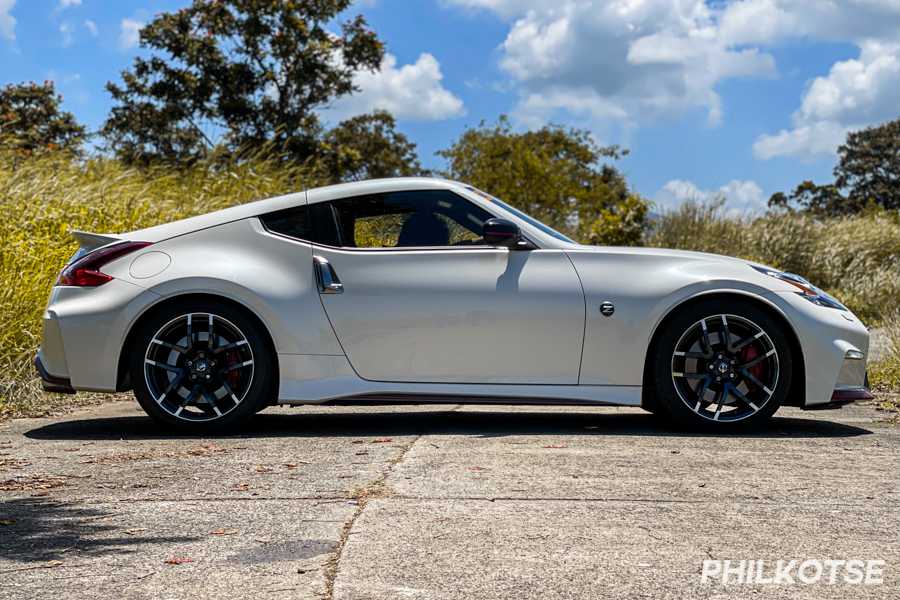 A picture of the side of the 2020 Nissan 370Z Nismo parked on the middle of the road