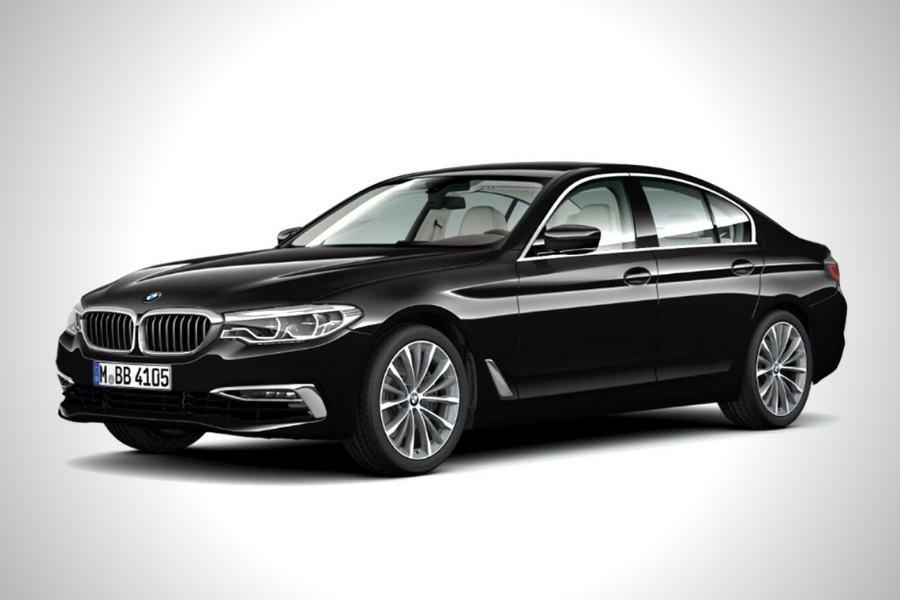 A picture of a black BMW 5-Series with a white background.