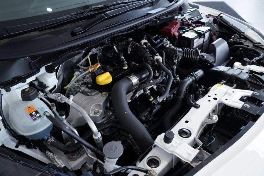 A picture of the Nissan Almera's open engine bay showing its 1.0-liter turbo engine.