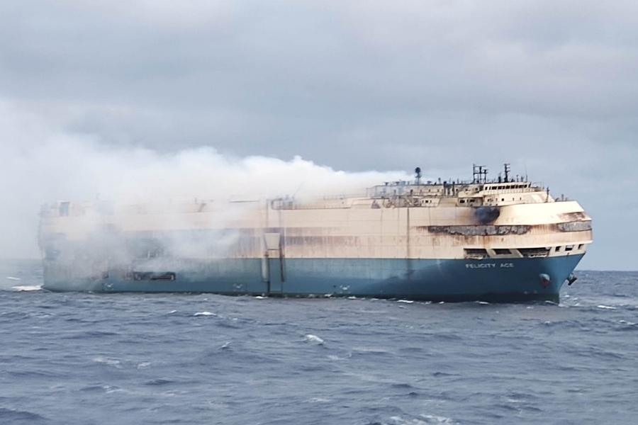 Firefighters struggling to extinguish burning ship carrying Porsches