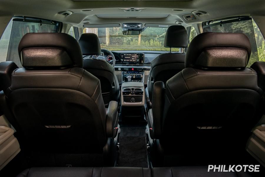 A picture of the Kia Carnival's interior taken from the third row