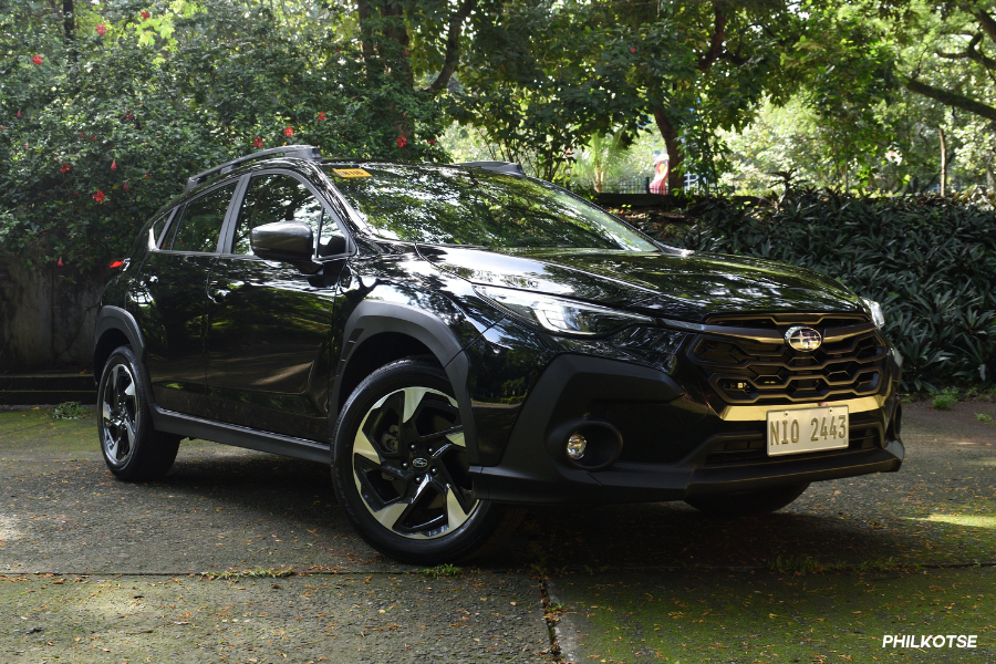 Crosstrek front quarter shot under trees. 