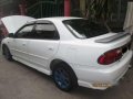 Mazda 323 sports car and Yamaha mio soul MC-6