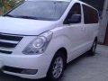 2011 hyundai grand starex . 2011 ford fiesta-0