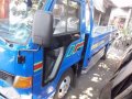 Isuzu Elf Dropside-3
